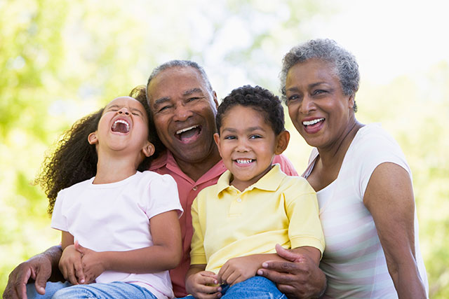 grandparents laughing with grandchildren